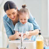 A,Cute,Little,Girl,And,Her,Mother,Are,Washing,Their